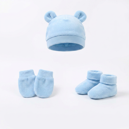 Thermal sleepsuit (fleece-lined) + Cosy baby socks (x3 pairs) + Scratch-proof mittens + Soft knit beanie + Warm cotton vests (x2)