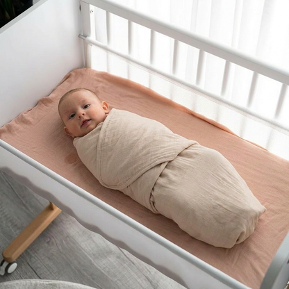 Swaddle blanket + Sleep sack (0-6 months) + White noise machine + Warm amber night light