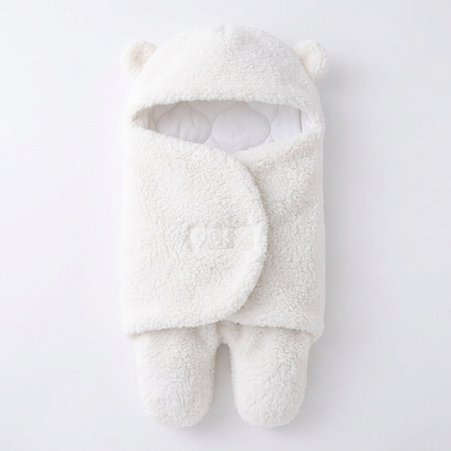 Swaddle blanket + Sleep sack (0-6 months) + White noise machine + Warm amber night light